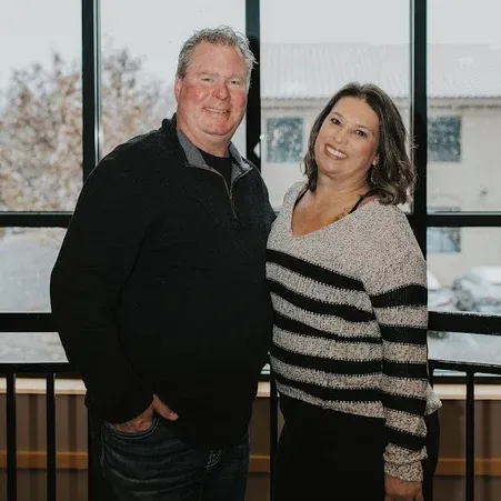 Eric and Amanda Thompson in their Fort Collins agency office