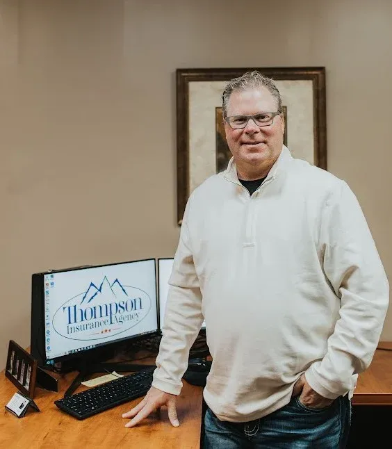 Eric Thompson at his desk, Thompson Insurance Agency